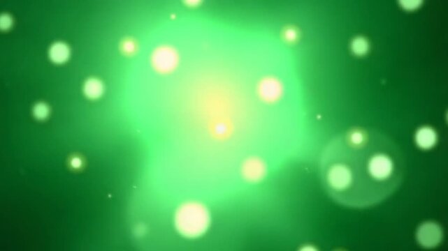 Magic dust from particles, shining bokeh, abstract background, flight of green cosmic particles. slow motion, seamless loop, 4K