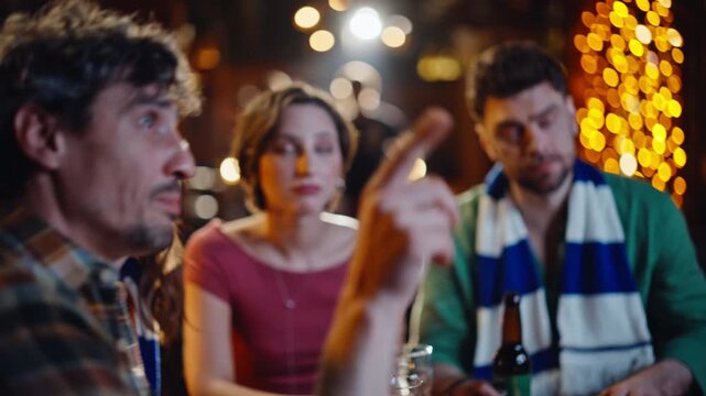 Relaxed people discussing football game watching match together in bar closeup.