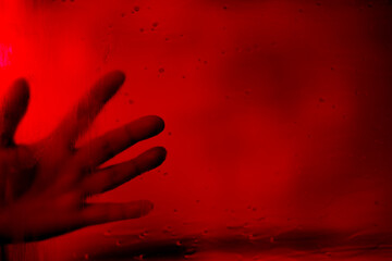 ghostly hands against dark, blood-red background, Frightening red palm shape, Halloween or nightmare, eerie and mysterious, fear and horror, Gothic or supernatural theme, thriller and suspense
