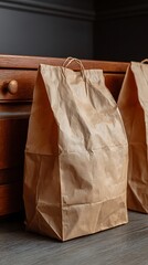 Neatly Folded Brown Paper Bags in a Light Wood Kitchen Drawer