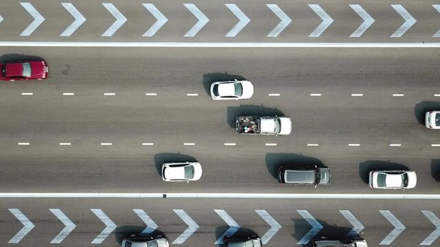 Aerial Drone Clip Looking Down On The Commuter Traffic jam. Aerial video of traffic jam in rush hour. vehicle traffic on motorway. Moderate car traffic.