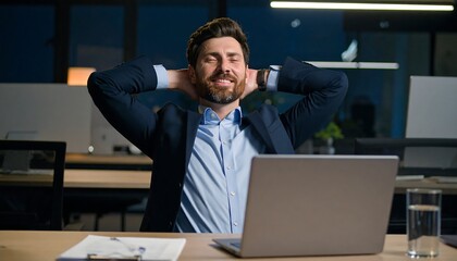 Relaxed businessman at night office (1)
