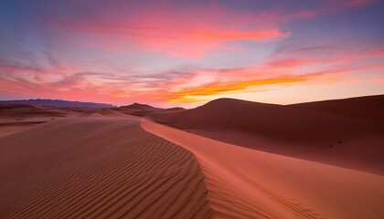 Naklejka premium a minimalist desert sunset landscape with a pink sky in the background creating a serene and calming atmosphere