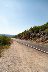 Road through rocky landscape.