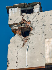 hole in the wall of the house from a bomb hit war in Ukraine