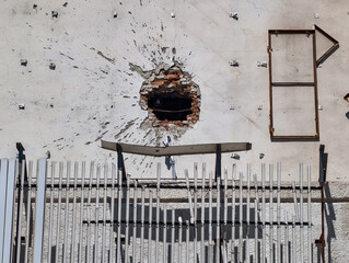 hole in the wall of the house from a bomb hit war in Ukraine