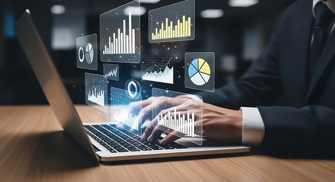 Businessman analyzing financial data and charts on a laptop with glowing holographic projections of graphs and statistics in a modern office setting representing technology and business growth