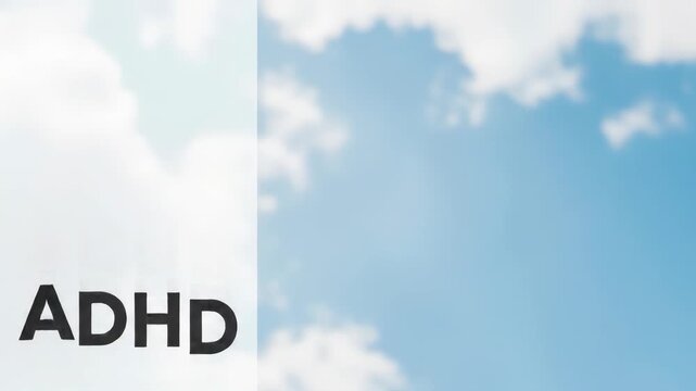 bright orange ribbon held against blue sky with clouds. adhd awareness month text. concept of support. healthcare, social campaign, educational banner on attention deficit hyperactivity disorder