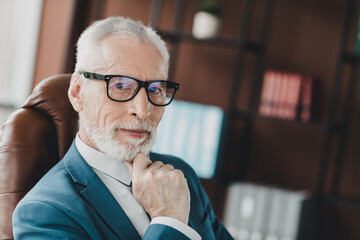 Senior businessman man in formal business suit confidently working in modern office setting with...