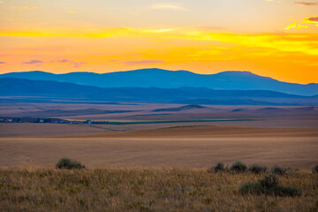Montana Mountains Across Valley Plains at Sunset