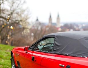 Red convertible car in a park
