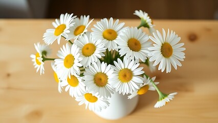 Fresh daisies arranged in a white ceramic vase, bringing a touch of nature indoors.