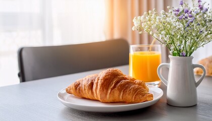 fresh croissant with orange juice and flower vase table morning