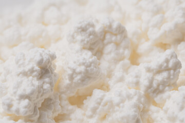 Ultra-detailed macro shot of creamy cottage cheese, highlighting its smooth curds and glossy texture. A perfect visual for high-protein dairy and healthy eating content