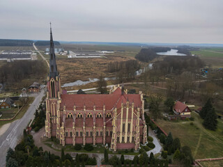 Neo Gothic Catholic Church with Spire in Rural Belarus Landscape