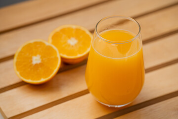 Glass of Fresh Orange Juice with Halved Oranges – Clean Minimal Food Photography
