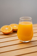 Glass of Fresh Orange Juice with Halved Oranges – Clean Minimal Food Photography