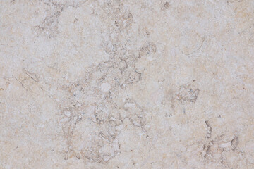 Beige worn granite tile surface. 