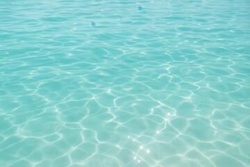 Crystal clear turquoise ocean surface with gentle waves creating natural luxury spa atmosphere