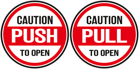 Two signs : caution push to open and  caution pull to open