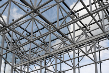 Glass and metal canopy structure – modern architectural construction with steel profiles and tubes