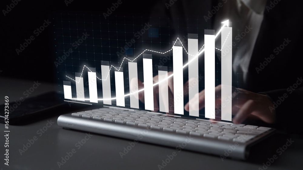 Poster a person uses a keyboard in a dark environment while a digital graph representing business growth ho