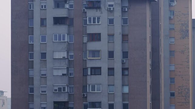 Urban residential apartment complexes captured under misty and cloudy environment in Skopje, Macedonia with visible air pollution