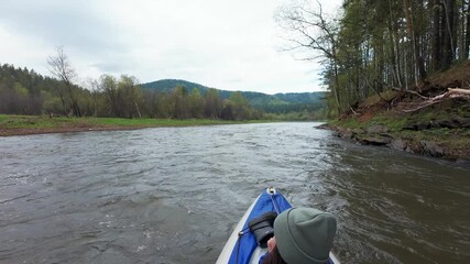 Experience the joy of kayaking on a stunning river that gracefully meanders through lush, green hills and serene forestsan ideal location for both nature enthusiasts and thrillseekers alike