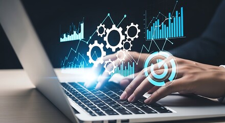Close up of hands typing on a laptop with futuristic glowing digital interface displaying charts graphs and gears symbolizing technology data analysis and innovation