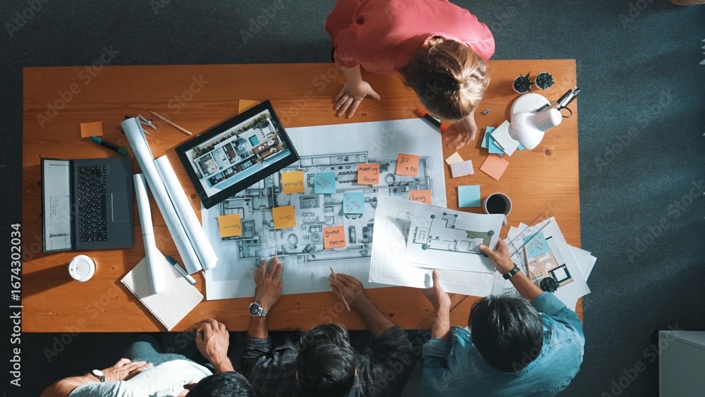 Aufkleber Top down aerial view of civil engineer hold project plan while design join meeting. Professional manager working together to design building construction while planning by using blueprint. Symposium.