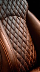 Close-up of a brown leather car seat with diamond quilting