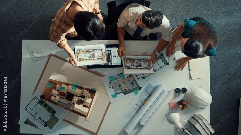 Poster top down view of skilled business man and colleague design house together. aerial view of architect 