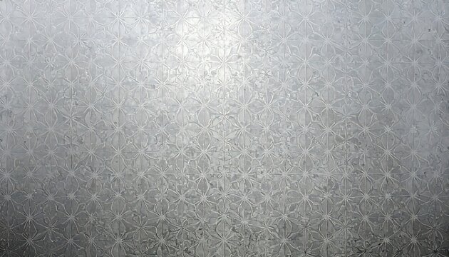A frosted glass surface with a repeating floral pattern