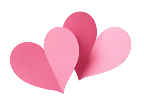Two overlapping pink paper hearts against a black background