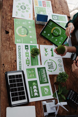 Businesswomen planning environmental social and governance strategy using tablet and printouts