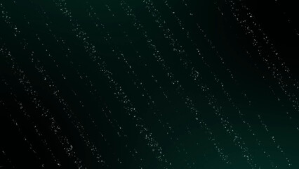 Glitter particle strings on dark green and black gradient background