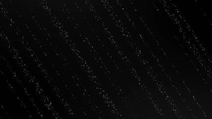 Glitter particle strings on black background