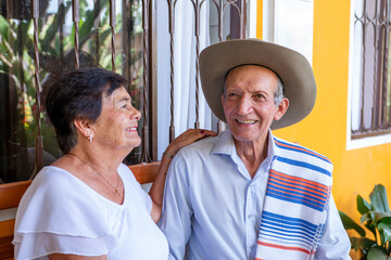 very happy couple of Latin American peasant grandparents