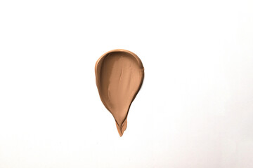 Smear of liquid foundation makeup texture isolated on a white background.