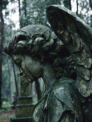 Stone Angel Statue in a Mysterious Forest Setting
