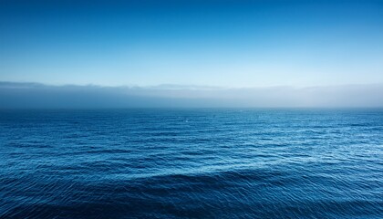 Obraz premium calm tranquil blue sea with no waves and with foggy backgroudn