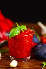 classic homemade red adjika with hot pepper and spices