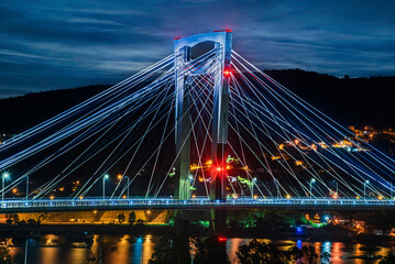 Obraz premium Night view of Rande Bridge over Vigo Estuary, illuminated single pillar