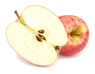 Sliced apple showing seeds next to whole apple on white surface