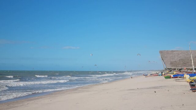Kitesurfers at sunny day in Prea beach, Ceara, Brazil.