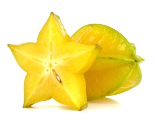 Fototapeta premium Ripe carambola fruit cut open showing star shape on white surface