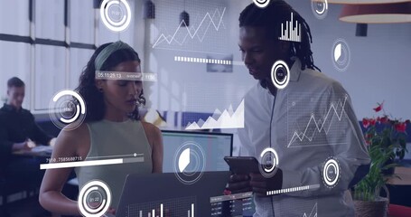 Woman glancing laptop and man tapping tablet are bringing up overlay graphs for business analysis - Powered by Adobe