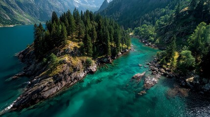 Aerial view of mountain lake peninsula with rocky shore and alpine water showing dramatic natural landscape shape ideal for travel stock or geographic texture themes