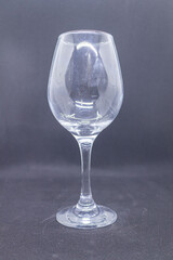 Elegant glass wine glass with a tall stem and wide bowl.