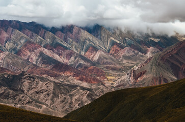 Colorful Hornocal mountain range in Jujuy under cloudy sky